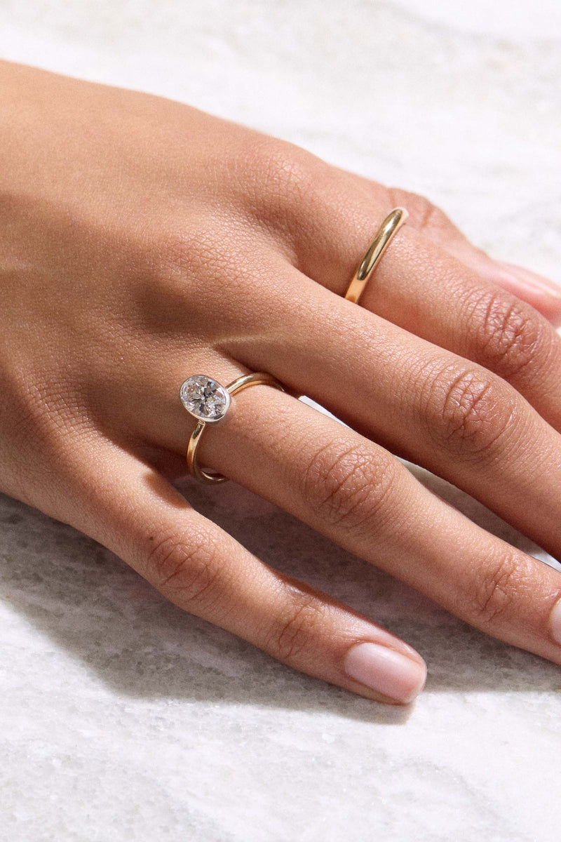 MILESTONE SIGNATURE BEZEL OVAL DIAMOND RING